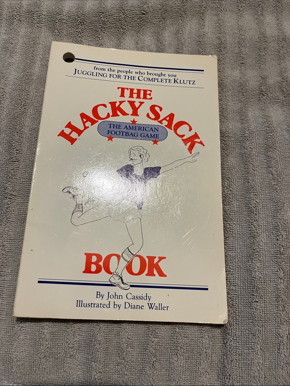 The Hacky Sack Book - White & Red Cover by John Cassidy